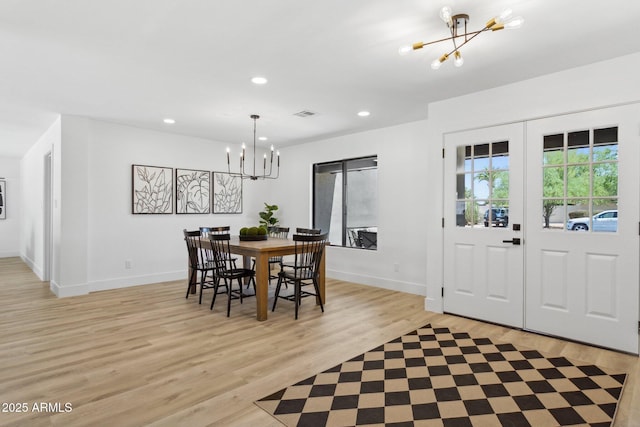 4842 E Surrey Ave, Scottsdale, AZ 85254 - dining area featuring a chandelier, light wood-style flooring, and recessed lighting