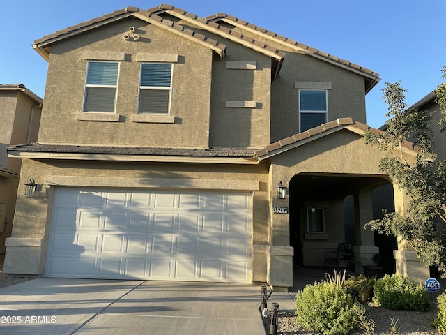 view of front of property featuring a garage