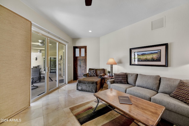 tiled living room featuring ceiling fan