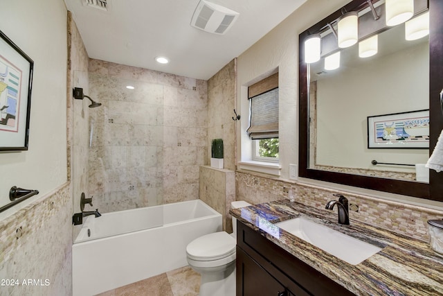 full bathroom featuring toilet, tiled shower / bath combo, tasteful backsplash, vanity, and tile floors