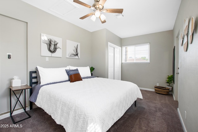 bedroom featuring dark colored carpet, a closet, visible vents, ceiling fan, and baseboards