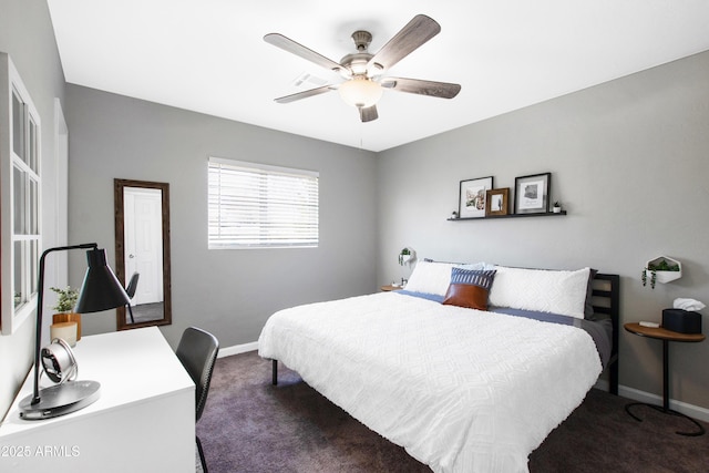 carpeted bedroom with a ceiling fan and baseboards