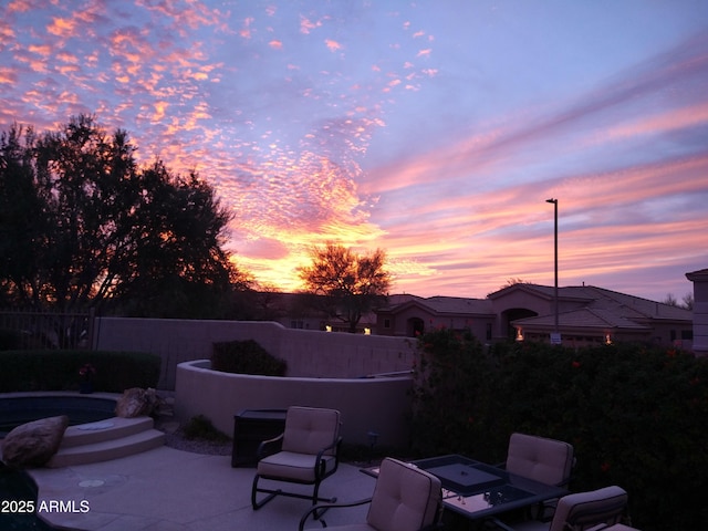 view of patio terrace at dusk