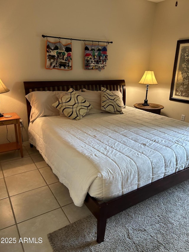 bedroom featuring tile patterned floors