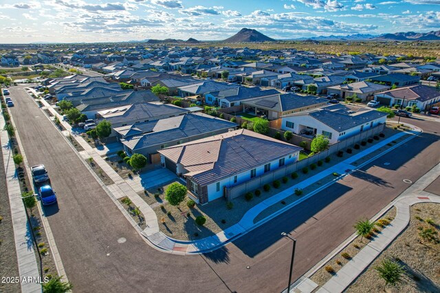 birds eye view of property with a mountain view