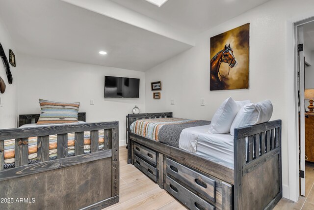 bedroom with light hardwood / wood-style flooring