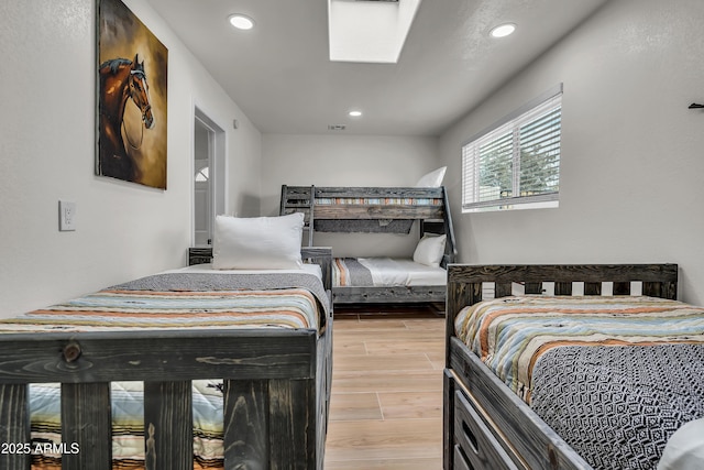 bedroom featuring a skylight