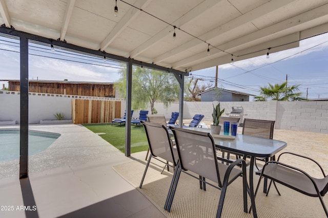 view of patio / terrace with a fenced in pool