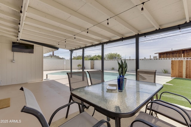 view of patio with a fenced in pool