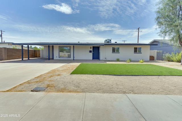 ranch-style house with a front lawn