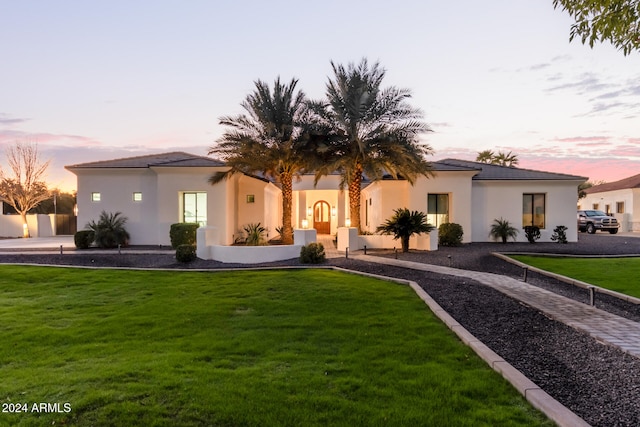 view of front of house with a lawn