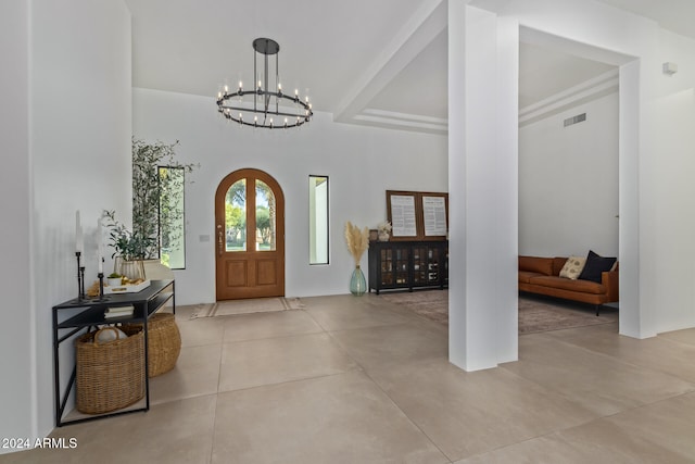 entryway with a notable chandelier