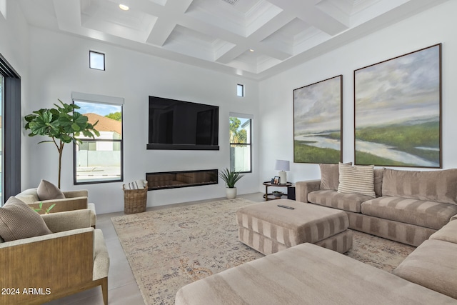 tiled living room with a towering ceiling, plenty of natural light, beamed ceiling, and coffered ceiling