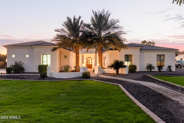 view of front of property with a yard