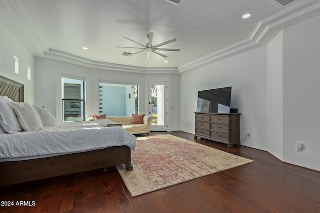 bedroom with ornamental molding, dark wood-type flooring, and ceiling fan