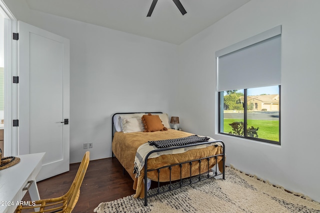 bedroom featuring ceiling fan and dark hardwood / wood-style floors