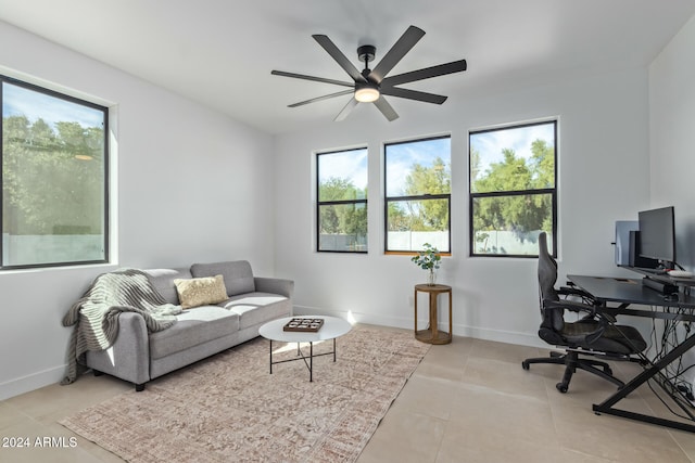 office space with light tile patterned floors and ceiling fan