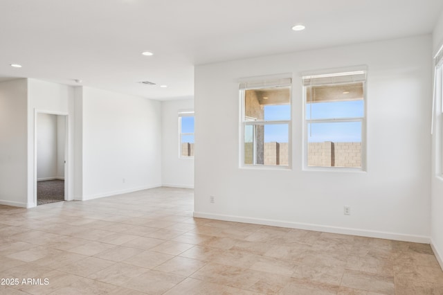12473 E Bahia Ct, Florence, AZ 85132 - spare room with baseboards, recessed lighting, and light tile patterned flooring