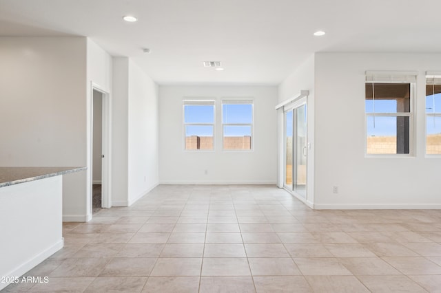 12473 E Bahia Ct, Florence, AZ 85132 - spare room featuring visible vents, baseboards, recessed lighting, and light tile patterned flooring