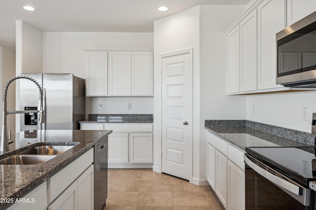 12473 E Bahia Ct, Florence, AZ 85132 - kitchen with a sink, appliances with stainless steel finishes, recessed lighting, white cabinetry, and dark stone counters