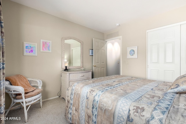 carpeted bedroom with a closet