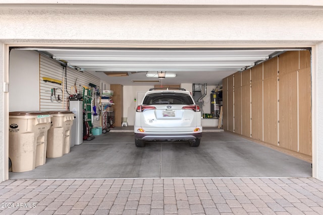 garage featuring water heater and gas water heater