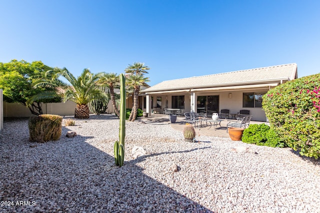 back of property featuring a patio area