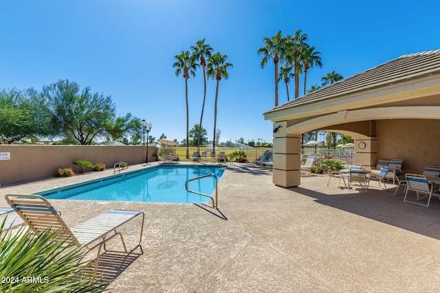 view of swimming pool with a patio area