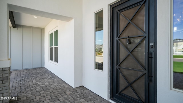 25228 S Star Dr, Queen Creek, AZ 85142 - view of exterior entry with board and batten siding and stucco siding