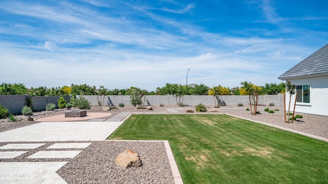 25228 S Star Dr, Queen Creek, AZ 85142 - view of yard featuring a fire pit, a patio area, and a fenced backyard