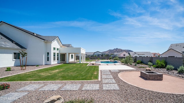 25228 S Star Dr, Queen Creek, AZ 85142 - view of yard featuring a fenced backyard, a patio, a hot tub, and a fire pit