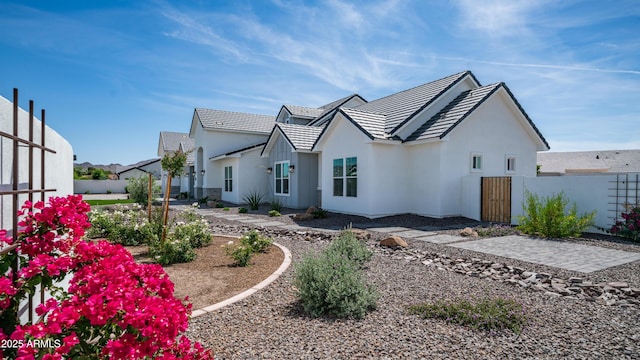 25228 S Star Dr, Queen Creek, AZ 85142 - exterior space featuring stucco siding, a tiled roof, and fence