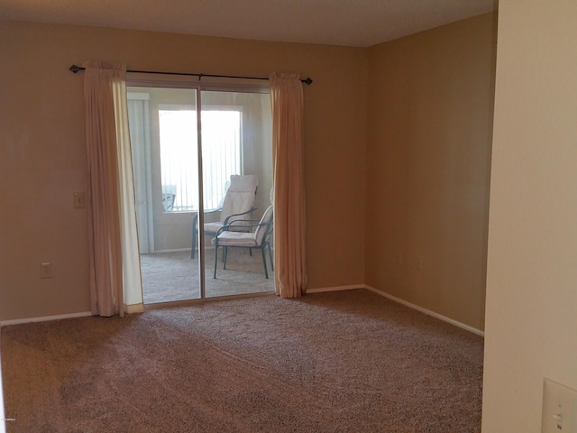 empty room featuring carpet floors