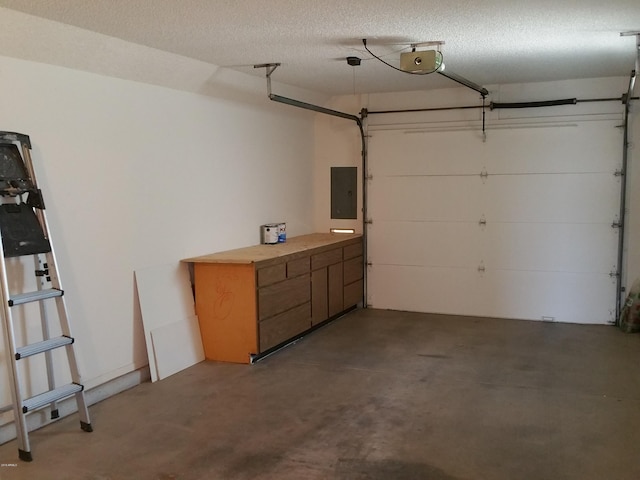 garage with a garage door opener and electric panel