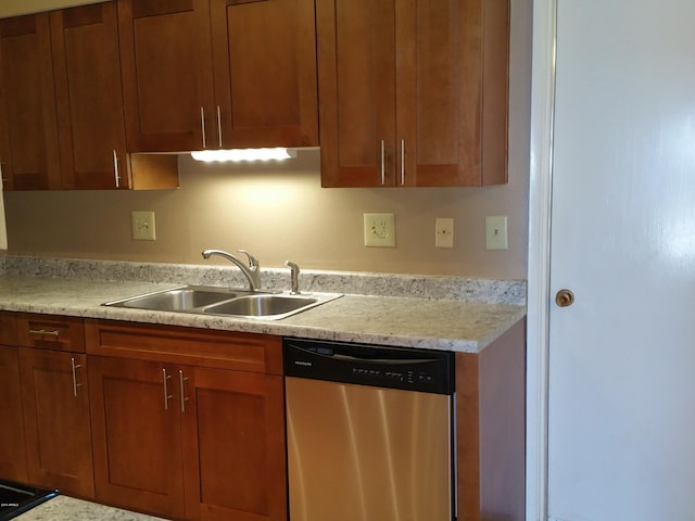 kitchen featuring stainless steel dishwasher and sink