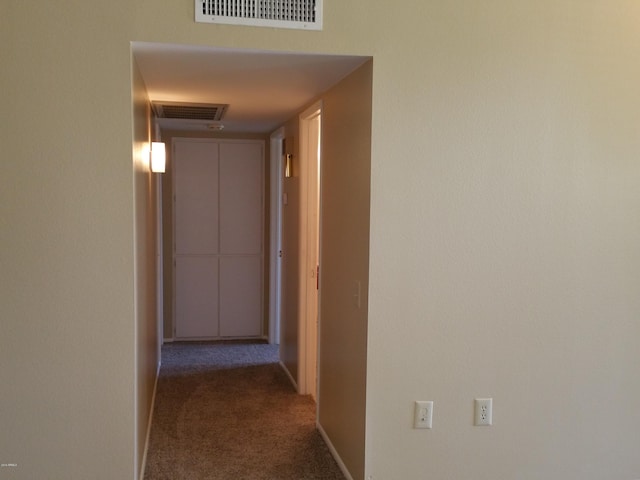 hallway with carpet flooring