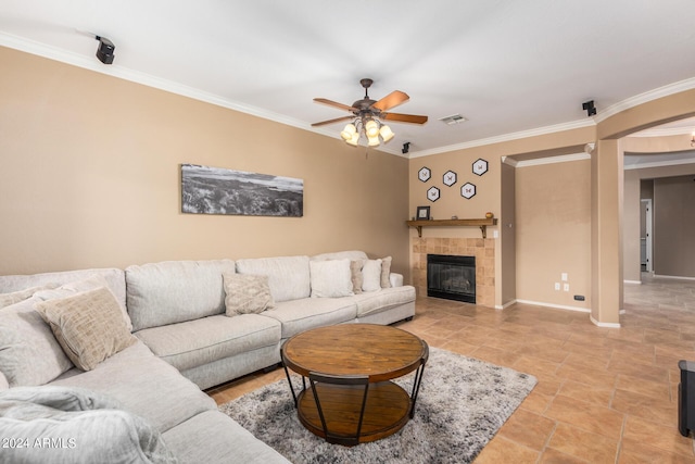 10902 E Silver Mine Rd, Gold Canyon, AZ 85118 - living room with a fireplace, ceiling fan, and crown molding