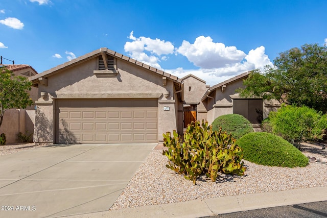 view of front of property with a garage