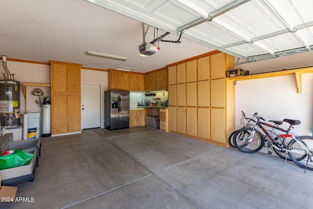 10902 E Silver Mine Rd, Gold Canyon, AZ 85118 - garage with gas water heater, stainless steel refrigerator with ice dispenser, and a garage door opener