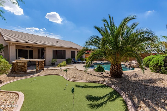 10902 E Silver Mine Rd, Gold Canyon, AZ 85118 - back of property featuring an outdoor kitchen, ceiling fan, and a patio