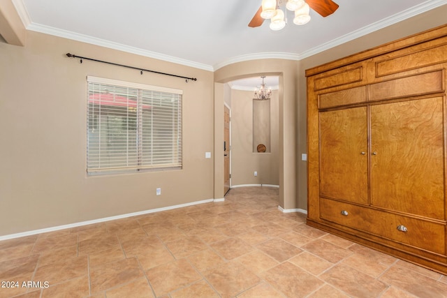 10902 E Silver Mine Rd, Gold Canyon, AZ 85118 - unfurnished bedroom featuring ceiling fan with notable chandelier, a closet, and crown molding