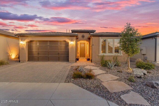 175 E Santa Lucia Ln, Queen Creek, AZ 85140 - view of front of home with a garage, stucco siding, a tiled roof, and decorative driveway