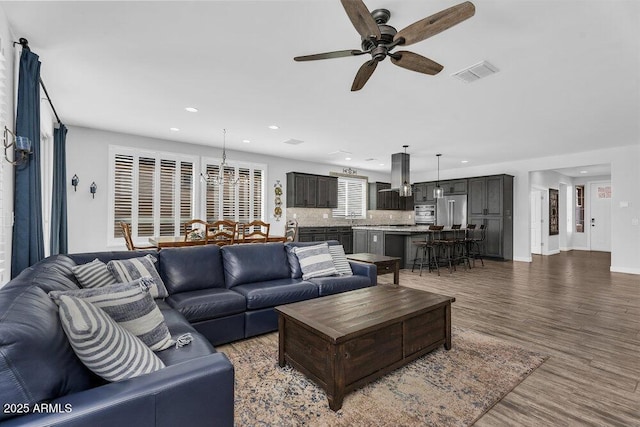 175 E Santa Lucia Ln, Queen Creek, AZ 85140 - living area featuring visible vents, baseboards, a ceiling fan, recessed lighting, and wood finished floors