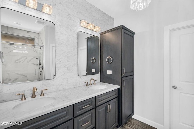 175 E Santa Lucia Ln, Queen Creek, AZ 85140 - full bath featuring double vanity, baseboards, a sink, and a stall shower