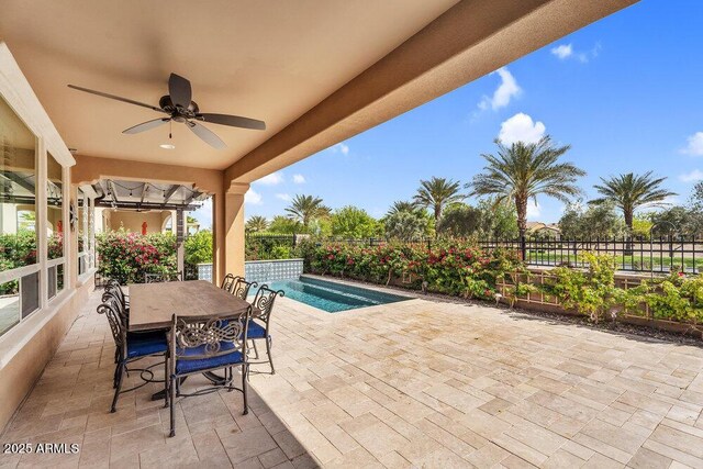 175 E Santa Lucia Ln, Queen Creek, AZ 85140 - view of patio / terrace with outdoor dining area, ceiling fan, a fenced in pool, and fence