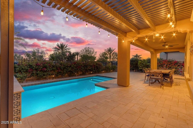 175 E Santa Lucia Ln, Queen Creek, AZ 85140 - pool at dusk with a fenced in pool, a patio, outdoor dining space, a pergola, and a fenced backyard