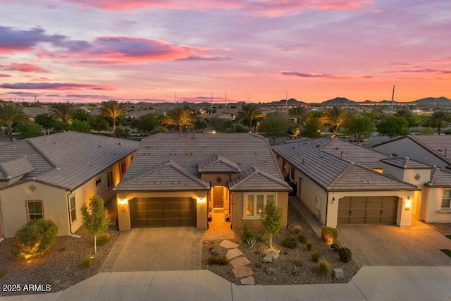 175 E Santa Lucia Ln, Queen Creek, AZ 85140 - view of front of property featuring a tiled roof, an attached garage, stucco siding, a residential view, and decorative driveway