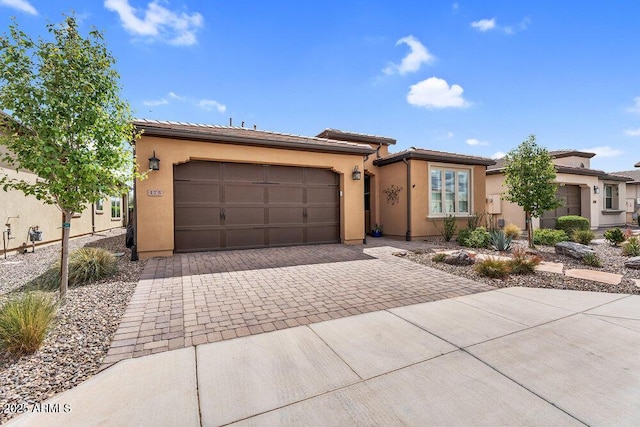 175 E Santa Lucia Ln, Queen Creek, AZ 85140 - view of front facade with an attached garage, stucco siding, a tile roof, and decorative driveway