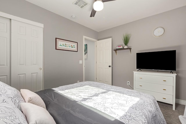 bedroom with ceiling fan, carpet flooring, and a closet