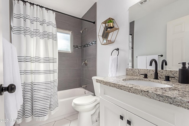 full bathroom featuring vanity, tile patterned floors, toilet, and shower / bath combo